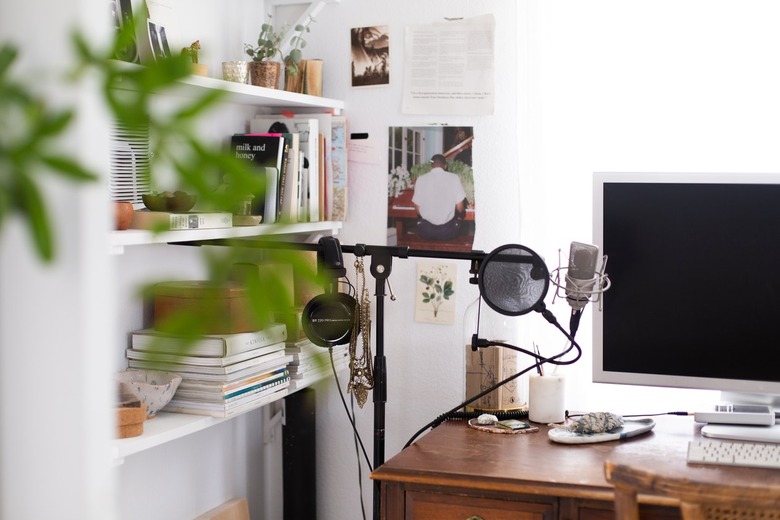 small home office with shelving for books and essentials